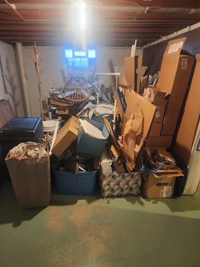 Roll-off dumpster container at job site for 4 Yard Dumpster Rental in Clinton